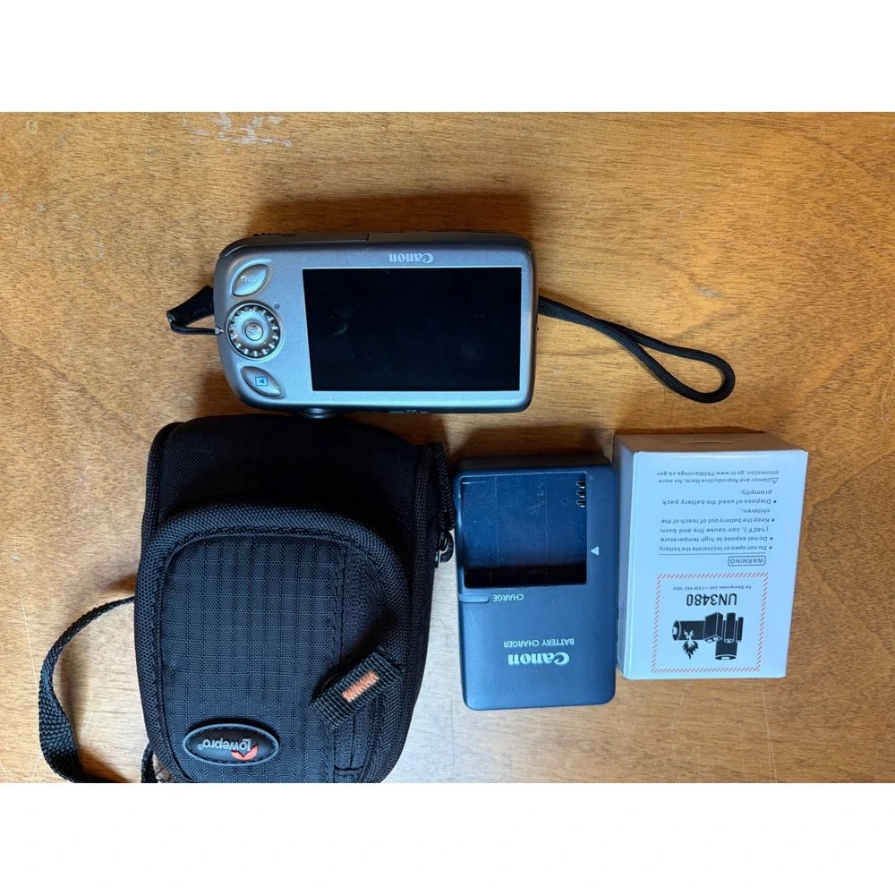 Canon Silver Digital Camera with Black Case and Charger